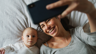 Parenting Support Collective in Manchester and Greater Manchester Boroughs authentic smiles from mother and baby taking selfies