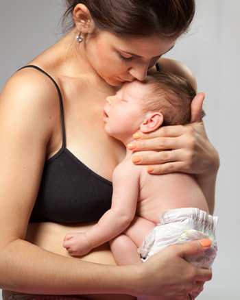 Parenting Support Collective in Manchester and Greater Manchester Boroughs mother holding new born in skin to skin position